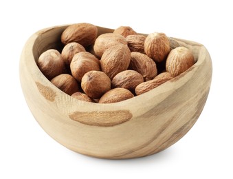 Photo of Fresh nutmegs in bowl isolated on white