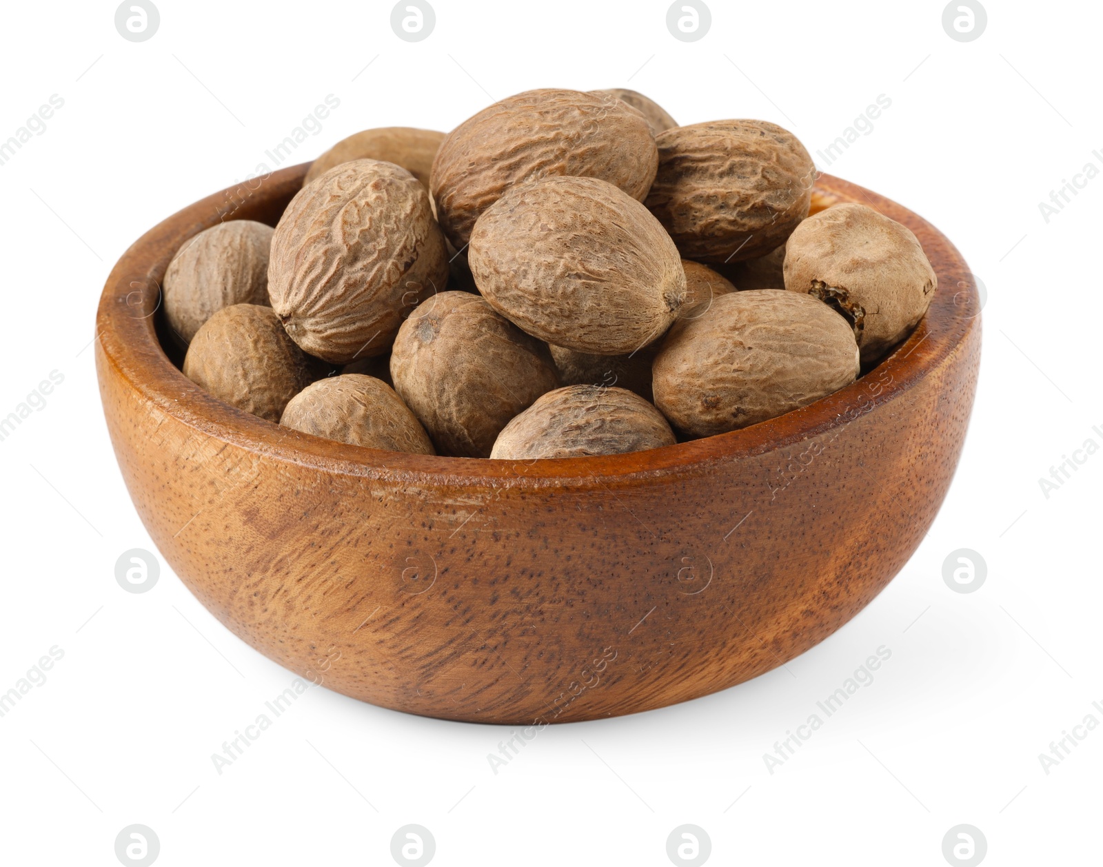 Fresh nutmegs in bowl isolated on white Photo of Fresh nutmegs in bowl isolated on white