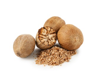 Photo of Whole, cut nutmegs and powder isolated on white