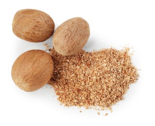 Photo of Whole nutmegs and powder isolated on white, top view