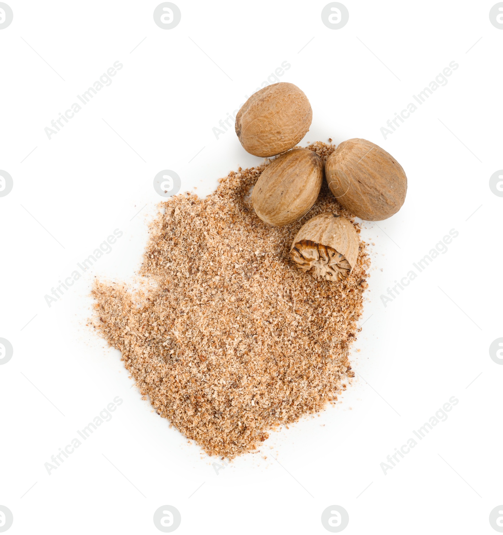 Whole, cut nutmegs and powder isolated on white, top view Photo of Whole, cut nutmegs and powder isolated on white, top view