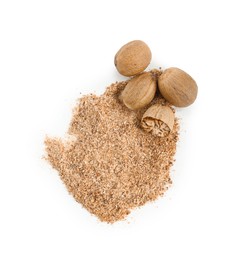 Photo of Whole, cut nutmegs and powder isolated on white, top view
