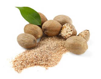 Photo of Whole, cut nutmegs, powder and leaf isolated on white