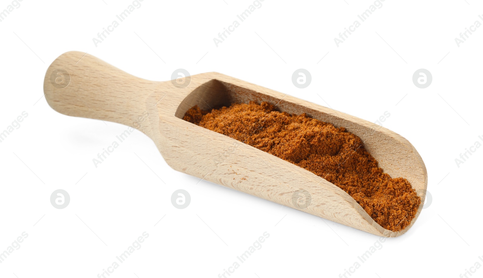 Nutmeg powder in scoop isolated on white Photo of Nutmeg powder in scoop isolated on white