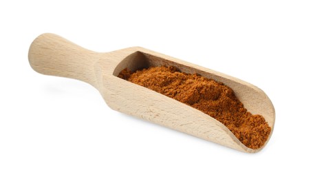Photo of Nutmeg powder in scoop isolated on white