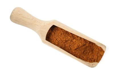 Photo of Nutmeg powder in scoop isolated on white, top view