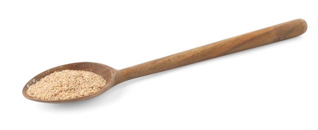 Photo of Nutmeg powder in spoon isolated on white