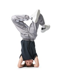 Photo of Boy in stylish clothes dancing on white background