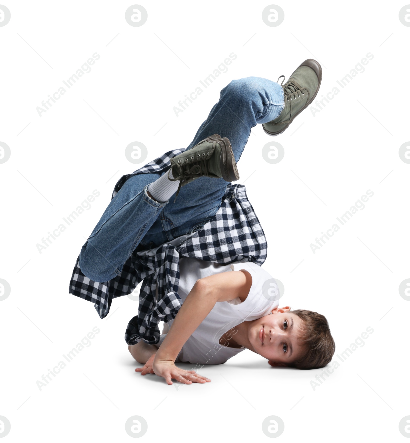 Boy in stylish clothes dancing on white background Photo of Boy in stylish clothes dancing on white background