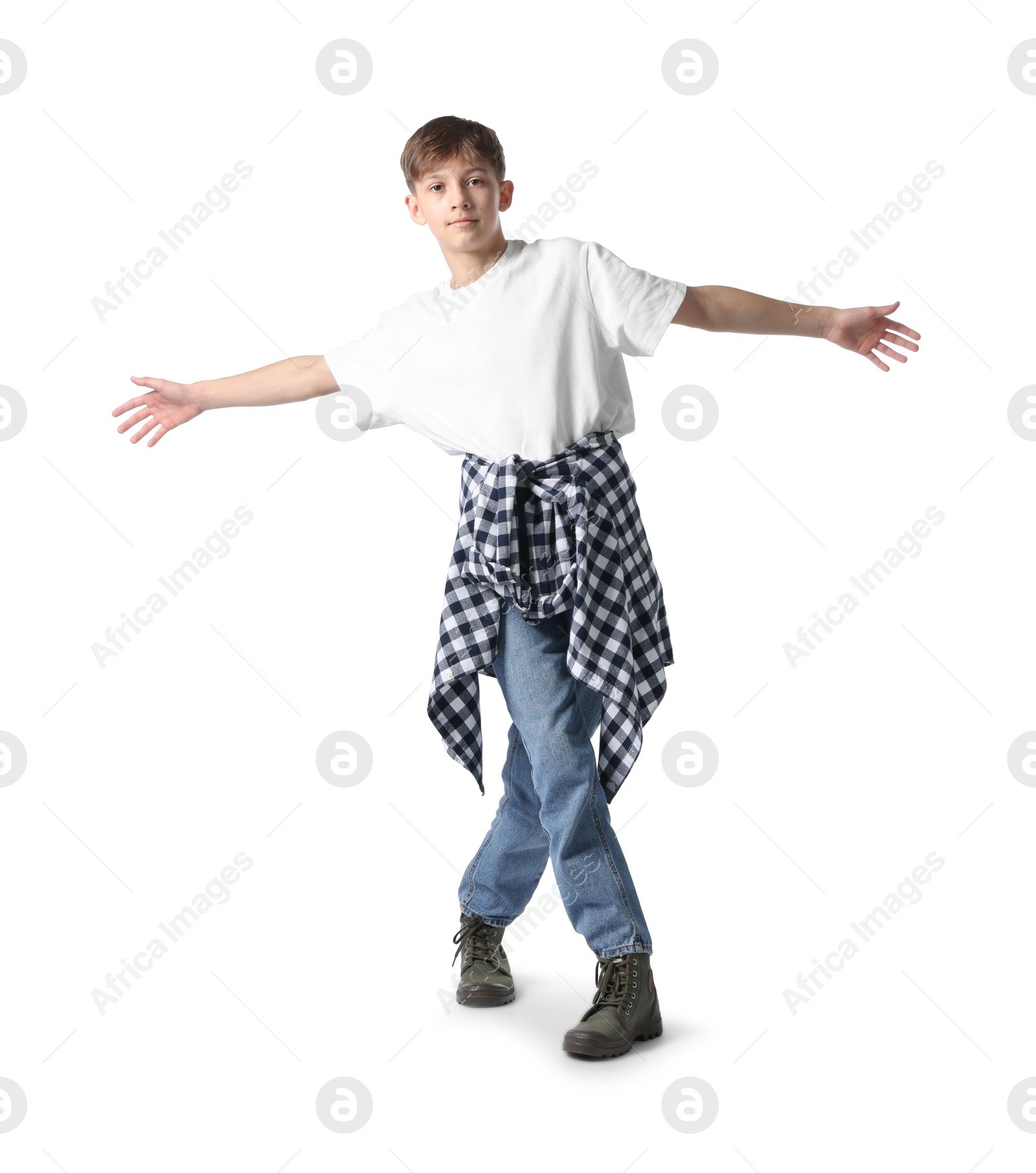 Boy in stylish clothes dancing on white background Photo of Boy in stylish clothes dancing on white background