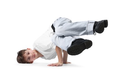 Photo of Boy in stylish clothes dancing on white background