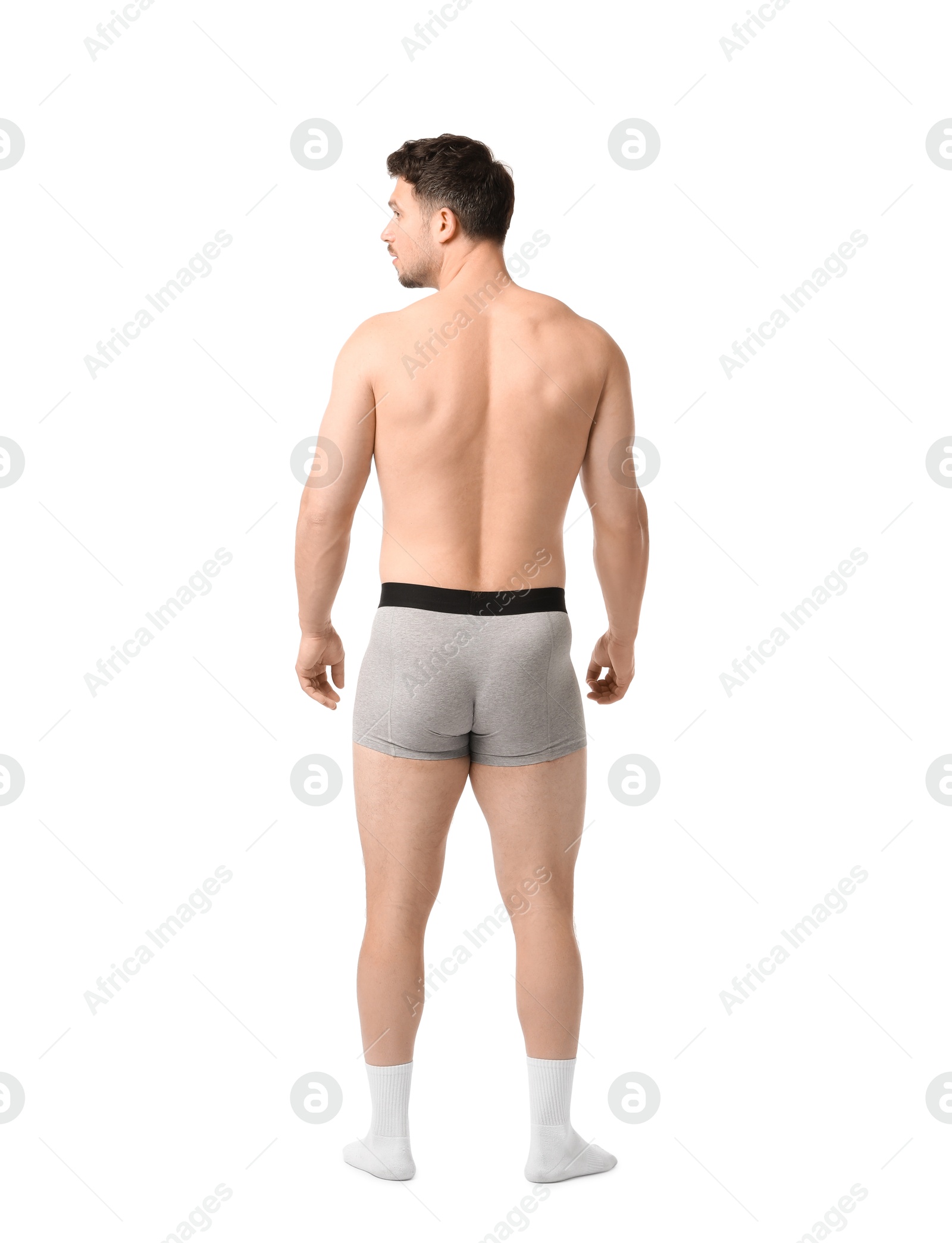 Young man in stylish light grey underwear on white background, back view Photo of Young man in stylish light grey underwear on white background, back view