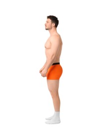 Photo of Young man in stylish orange underwear on white background