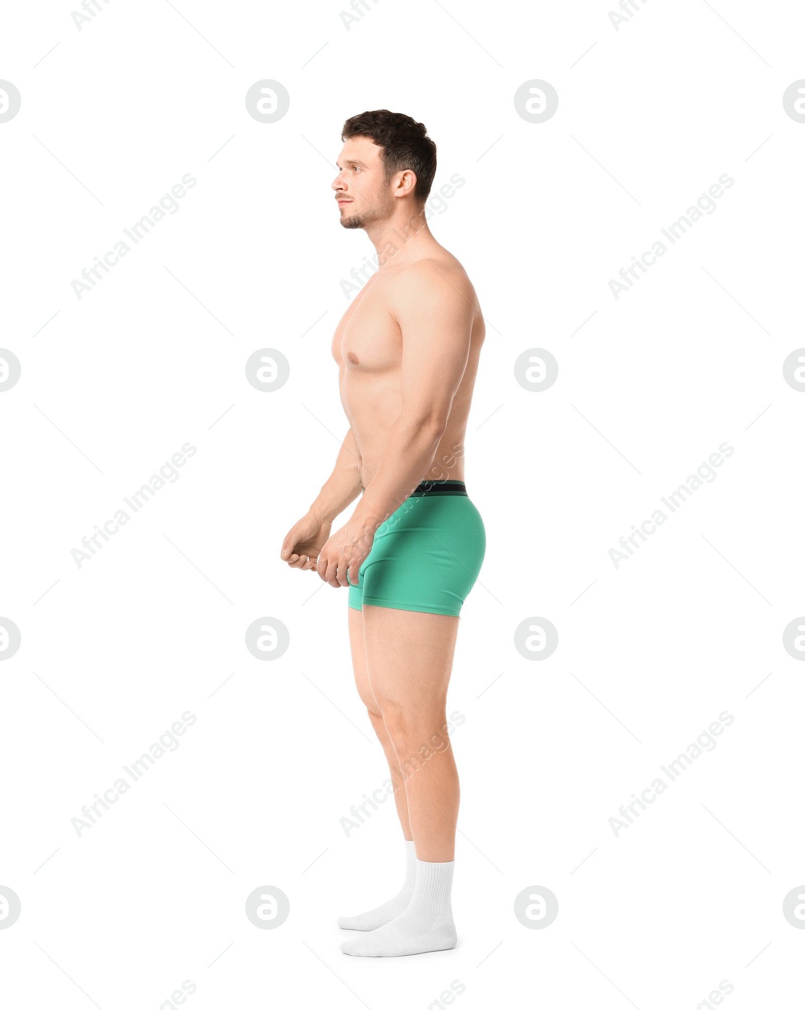 Young man in stylish turquoise underwear on white background Photo of Young man in stylish turquoise underwear on white background