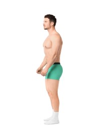 Photo of Young man in stylish turquoise underwear on white background