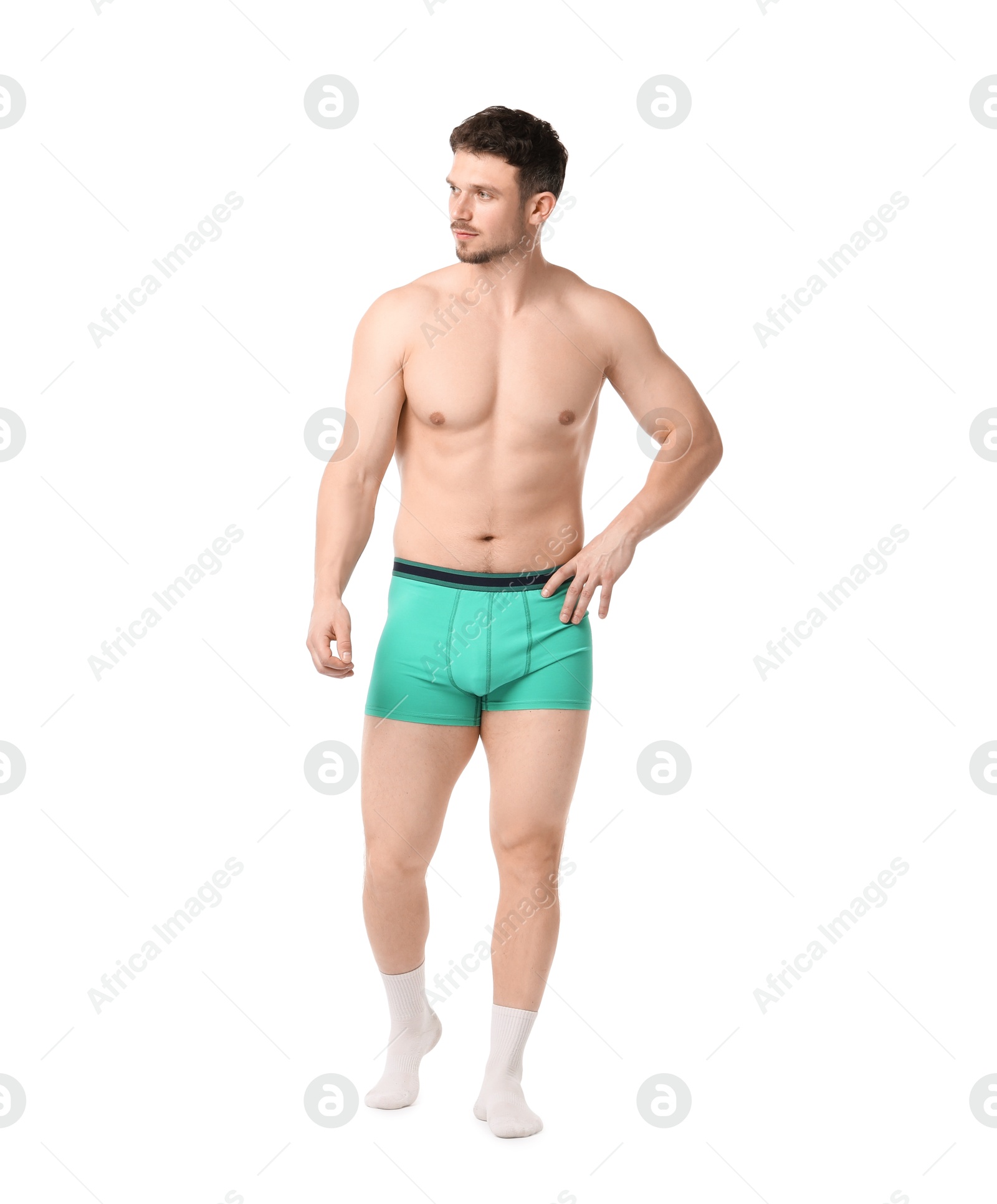 Young man in stylish turquoise underwear on white background Photo of Young man in stylish turquoise underwear on white background