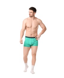 Photo of Young man in stylish turquoise underwear on white background