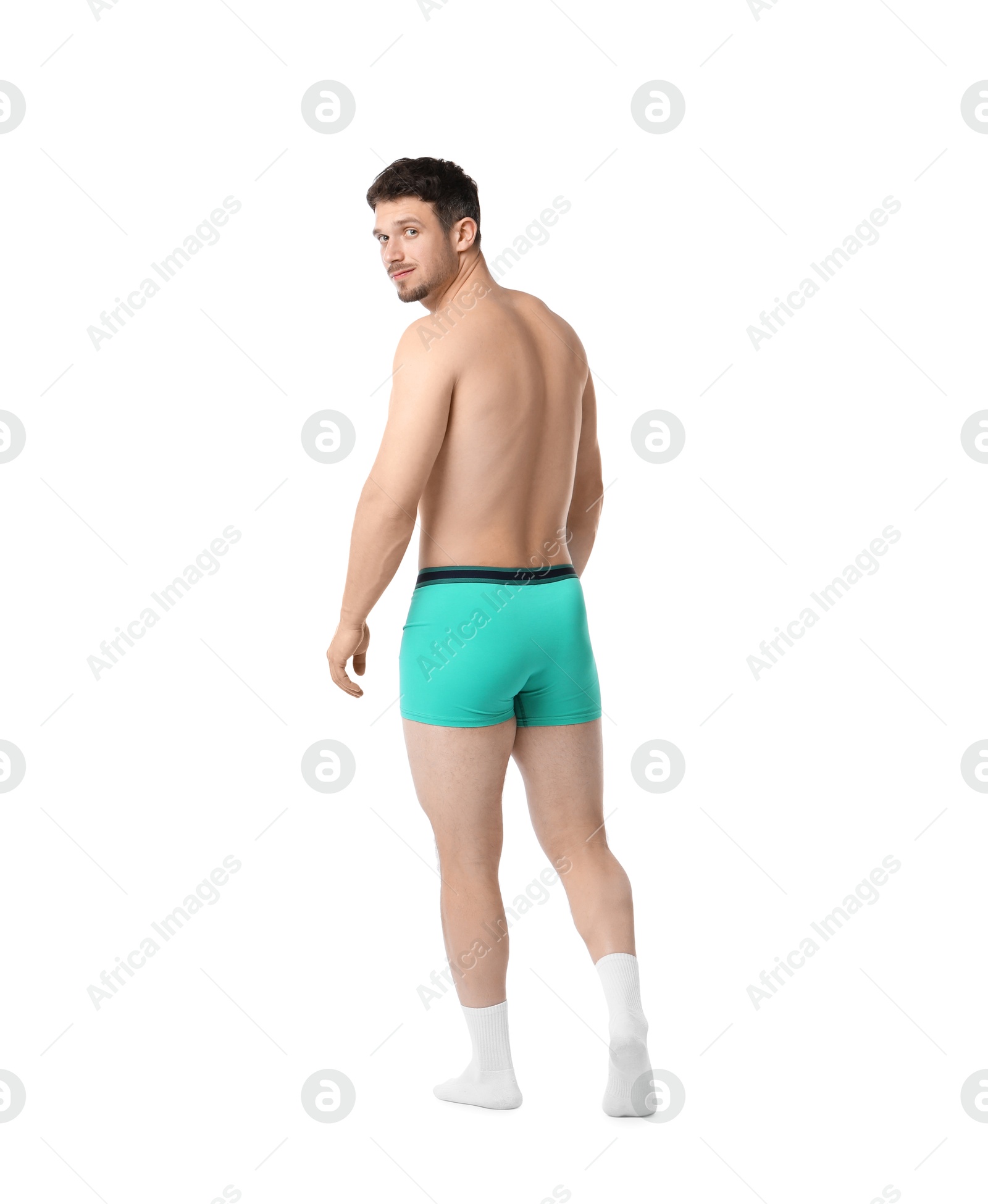 Young man in stylish turquoise underwear on white background Photo of Young man in stylish turquoise underwear on white background