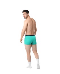 Photo of Young man in stylish turquoise underwear on white background