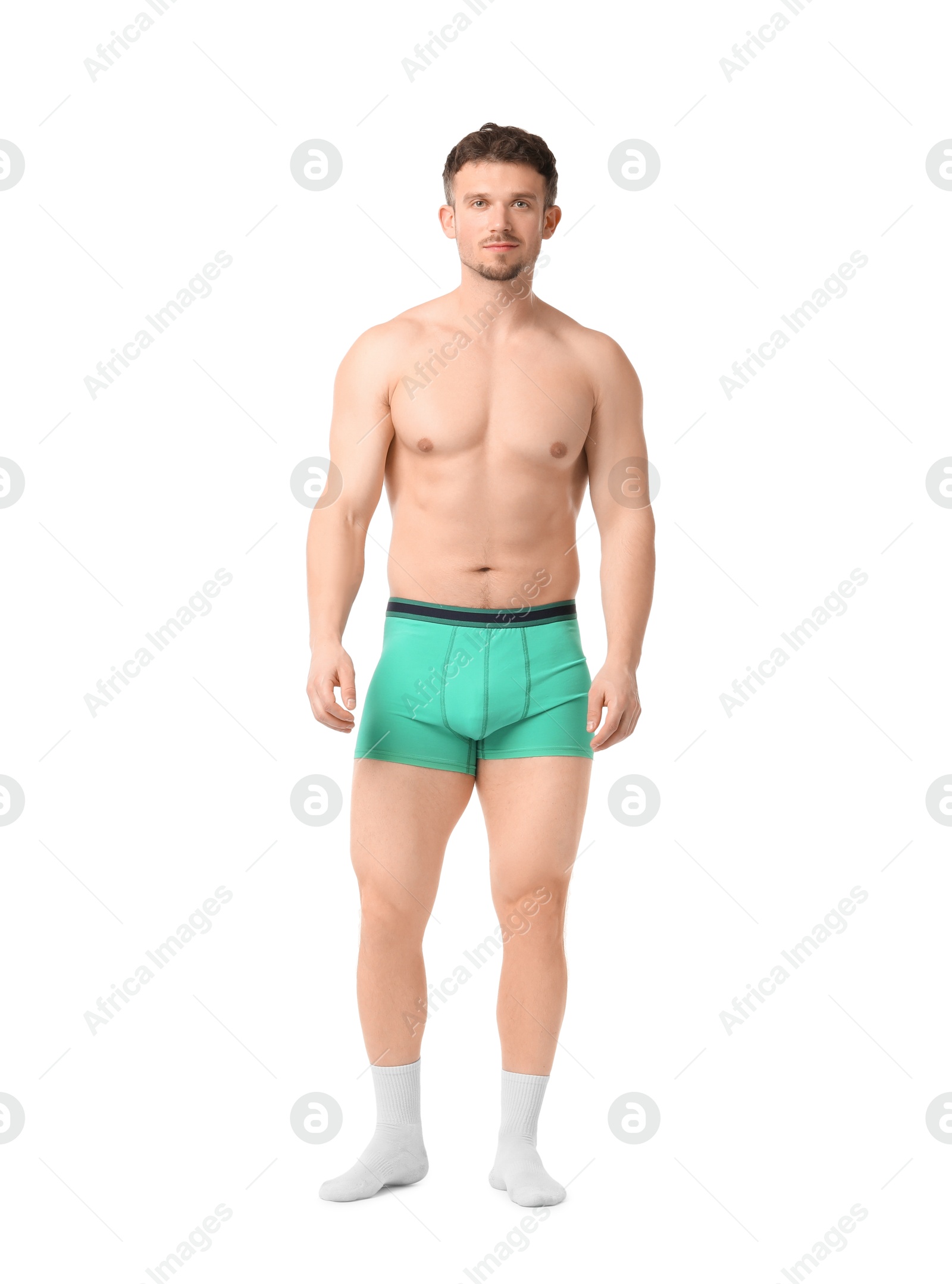 Young man in stylish turquoise underwear on white background Photo of Young man in stylish turquoise underwear on white background