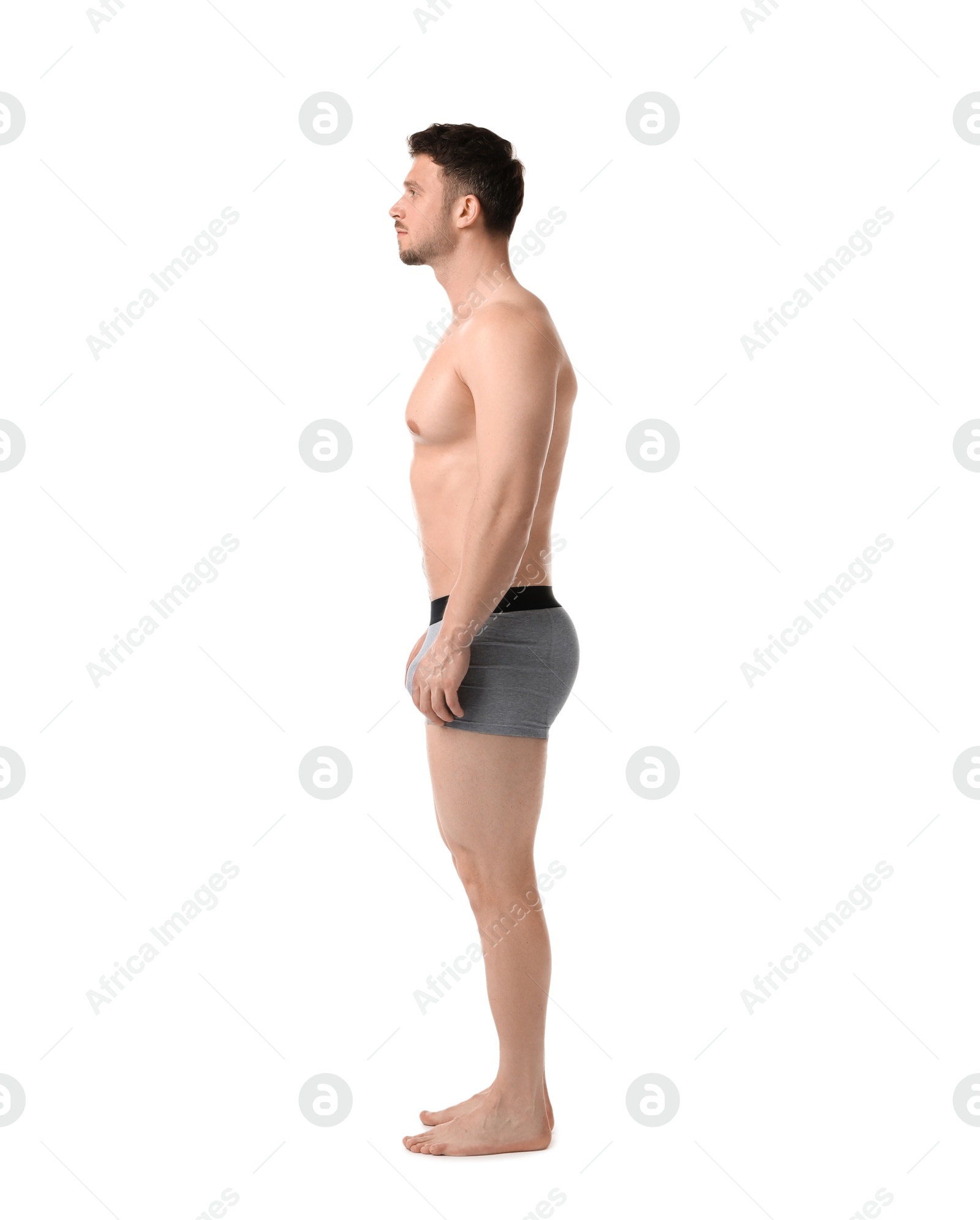 Young man in stylish light grey underwear on white background Photo of Young man in stylish light grey underwear on white background