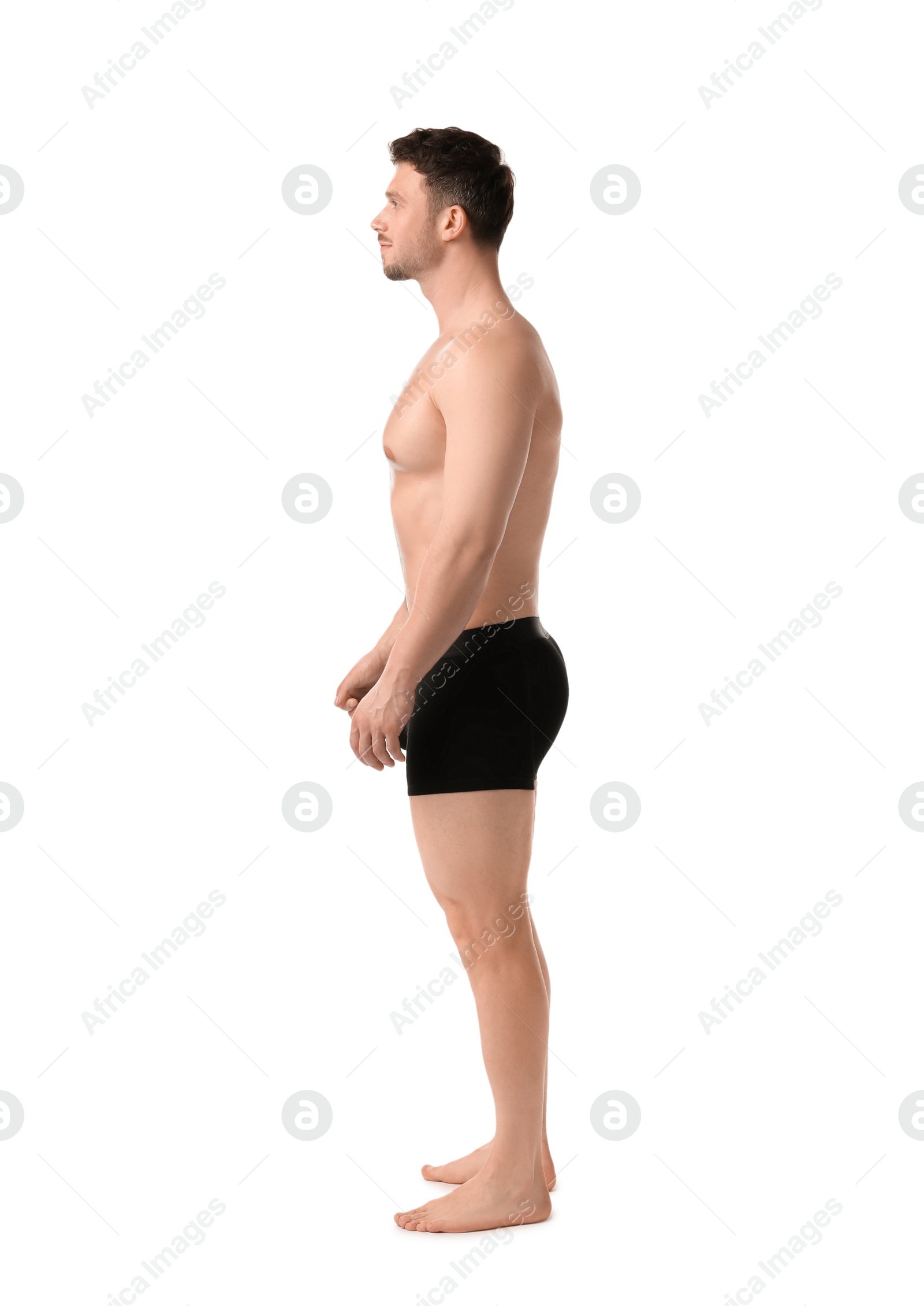 Young man in stylish black underwear on white background Photo of Young man in stylish black underwear on white background