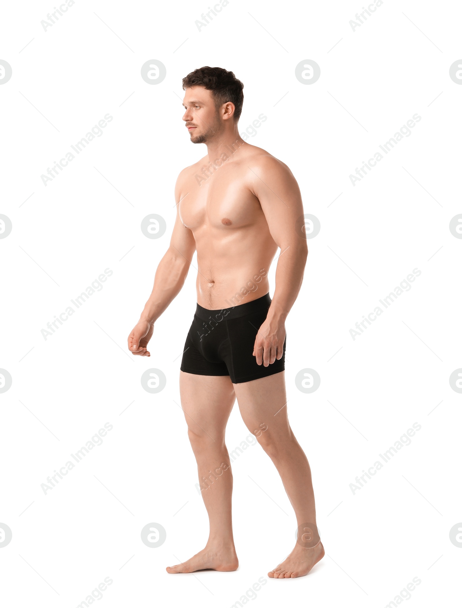 Young man in stylish black underwear on white background Photo of Young man in stylish black underwear on white background