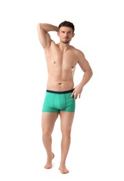 Photo of Young man in stylish turquoise underwear on white background