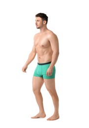 Photo of Young man in stylish turquoise underwear on white background