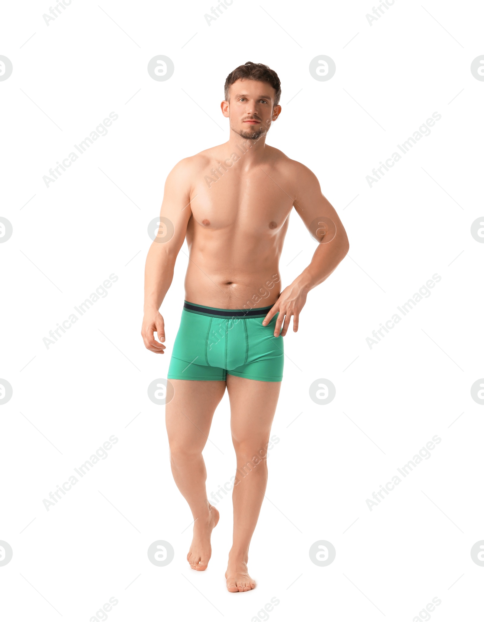 Young man in stylish turquoise underwear on white background Photo of Young man in stylish turquoise underwear on white background