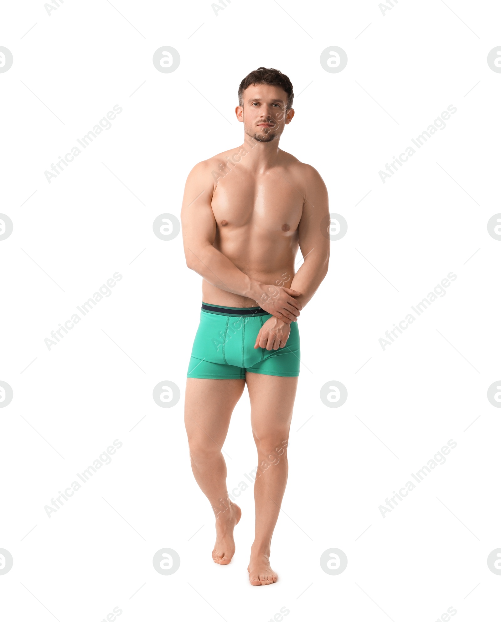 Young man in stylish turquoise underwear on white background Photo of Young man in stylish turquoise underwear on white background