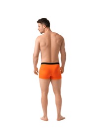 Photo of Young man in stylish orange underwear on white background, back view