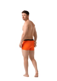 Photo of Young man in stylish orange underwear on white background