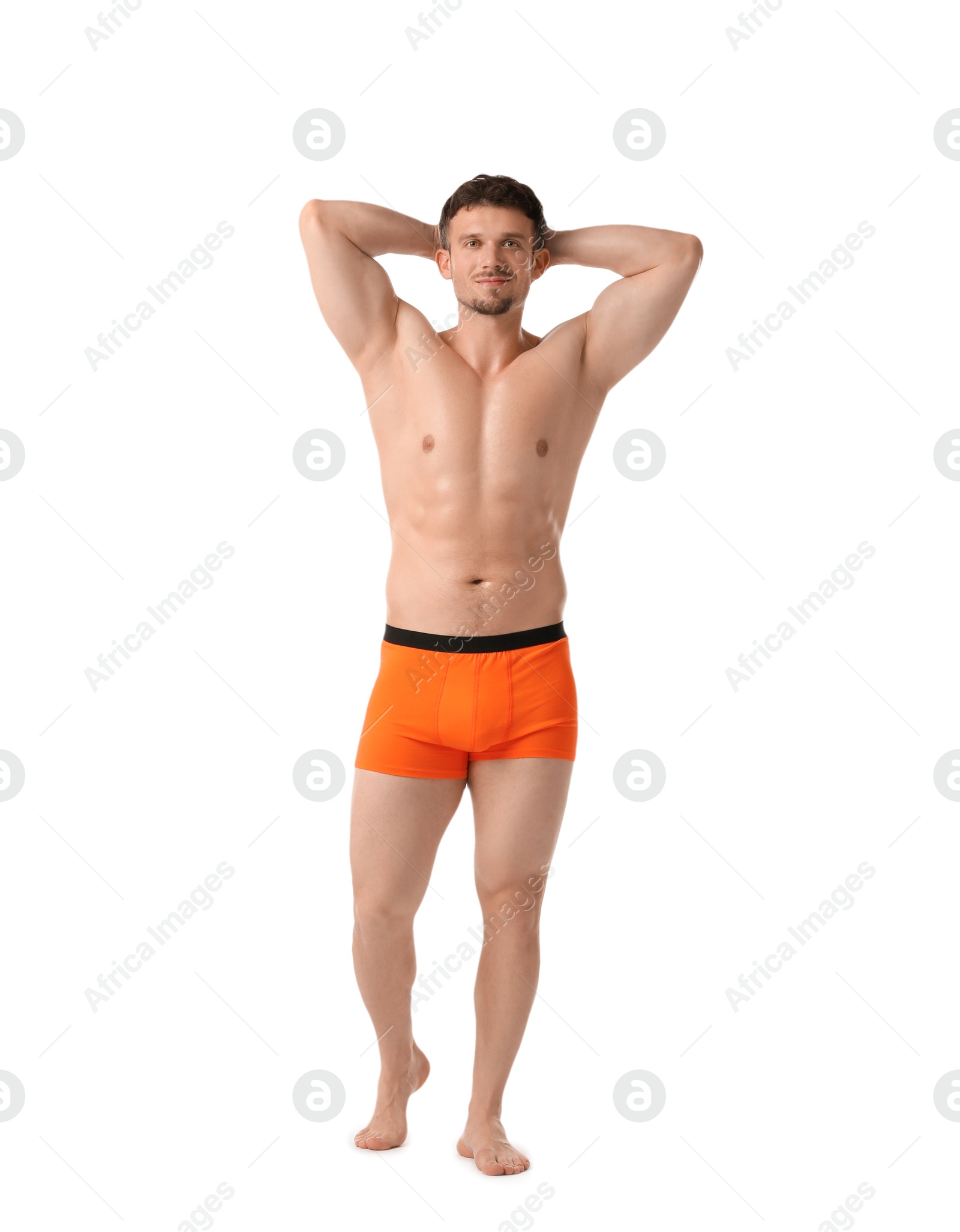 Young man in stylish orange underwear on white background Photo of Young man in stylish orange underwear on white background