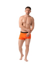 Photo of Young man in stylish orange underwear on white background
