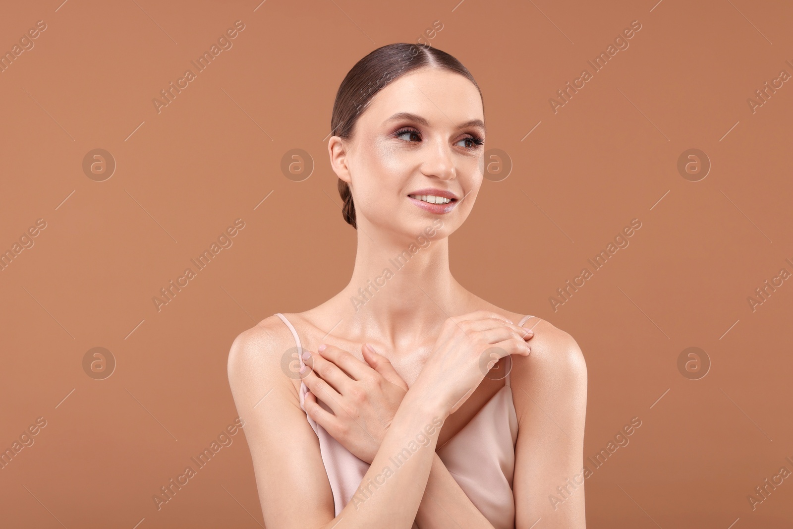 Portrait of beautiful young woman on beige background Photo of Portrait of beautiful young woman on beige background