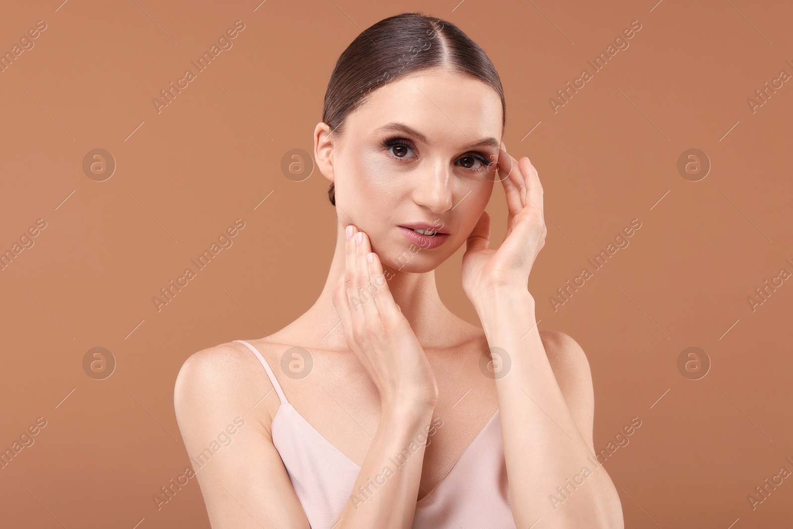 Portrait of beautiful young woman on beige background Photo of Portrait of beautiful young woman on beige background