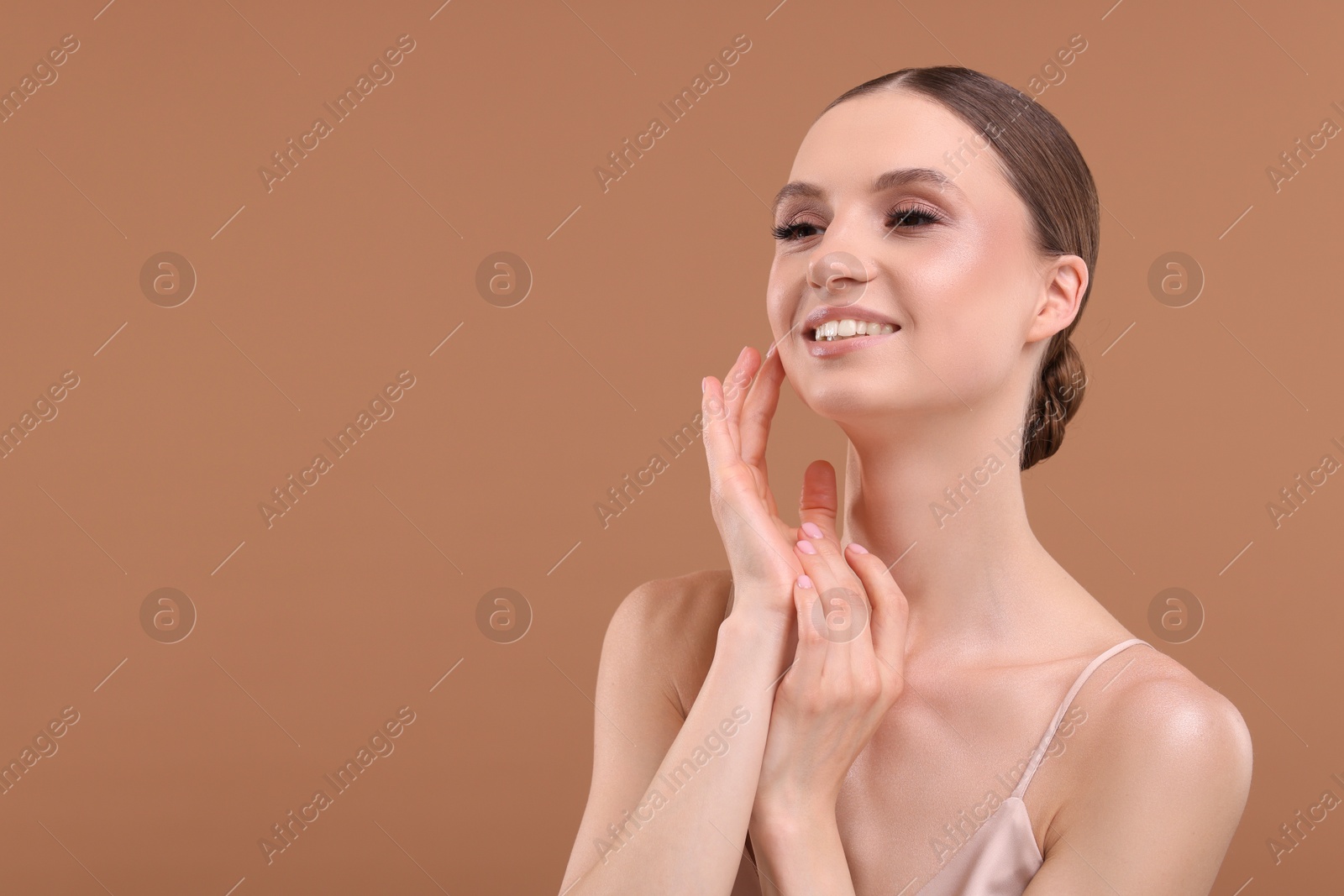 Portrait of beautiful young woman on beige background, space for text Photo of Portrait of beautiful young woman on beige background, space for text