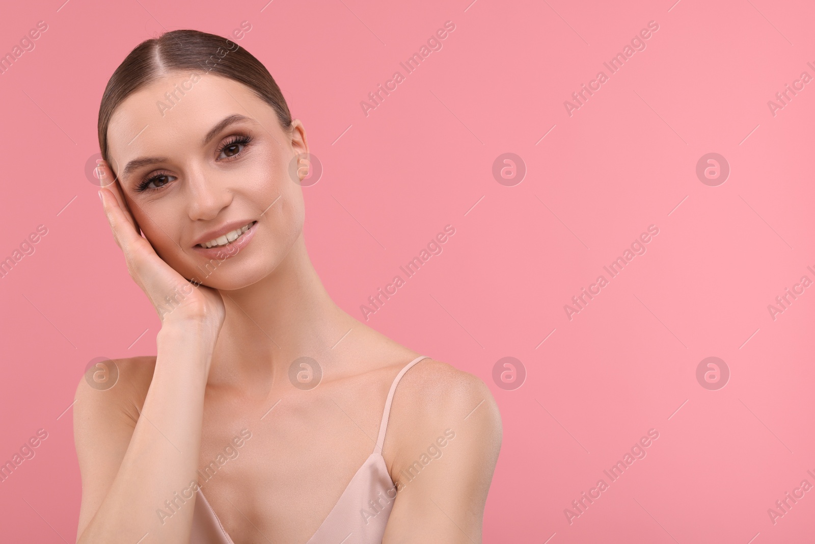Portrait of beautiful young woman on pink background, space for text Photo of Portrait of beautiful young woman on pink background, space for text