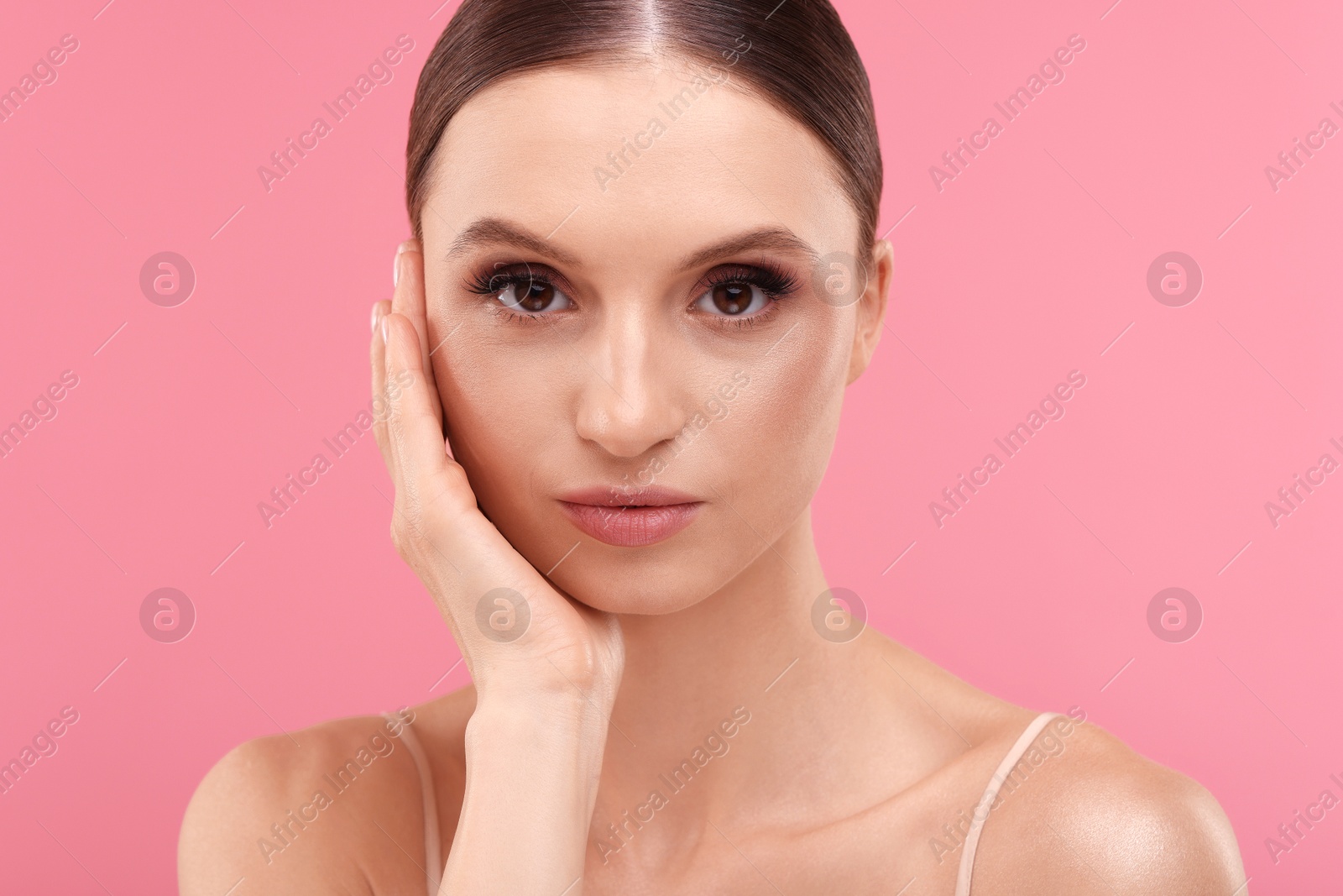 Portrait of beautiful young woman on pink background, closeup Photo of Portrait of beautiful young woman on pink background, closeup