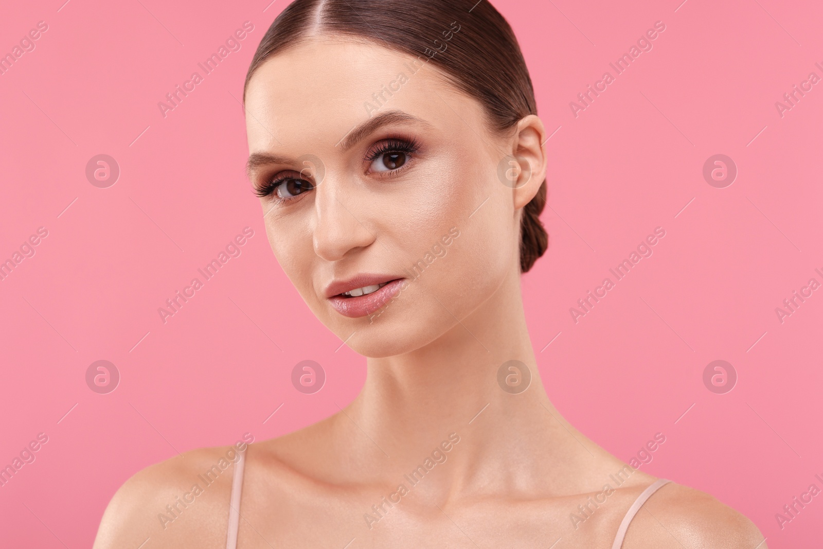 Portrait of beautiful young woman on pink background, closeup Photo of Portrait of beautiful young woman on pink background, closeup
