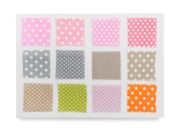 Photo of Samples of fabrics with polka dot pattern isolated on white, top view
