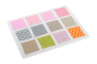 Photo of Samples of fabrics with polka dot pattern isolated on white