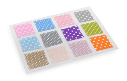 Photo of Samples of fabrics with polka dot pattern isolated on white