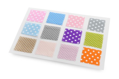 Photo of Samples of fabrics with polka dot pattern isolated on white