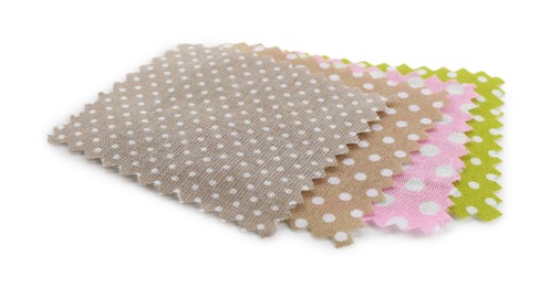 Photo of Samples of fabrics with polka dot pattern isolated on white