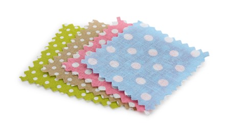 Photo of Samples of fabrics with polka dot pattern isolated on white