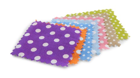 Photo of Samples of fabrics with polka dot pattern isolated on white