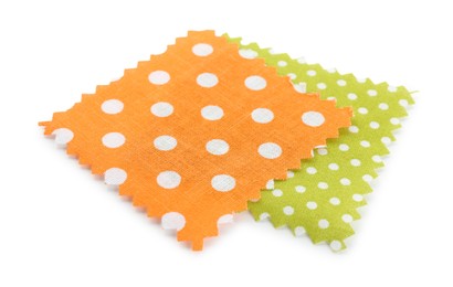 Photo of Samples of fabrics with polka dot pattern isolated on white