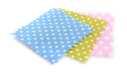 Photo of Samples of fabrics with polka dot pattern isolated on white